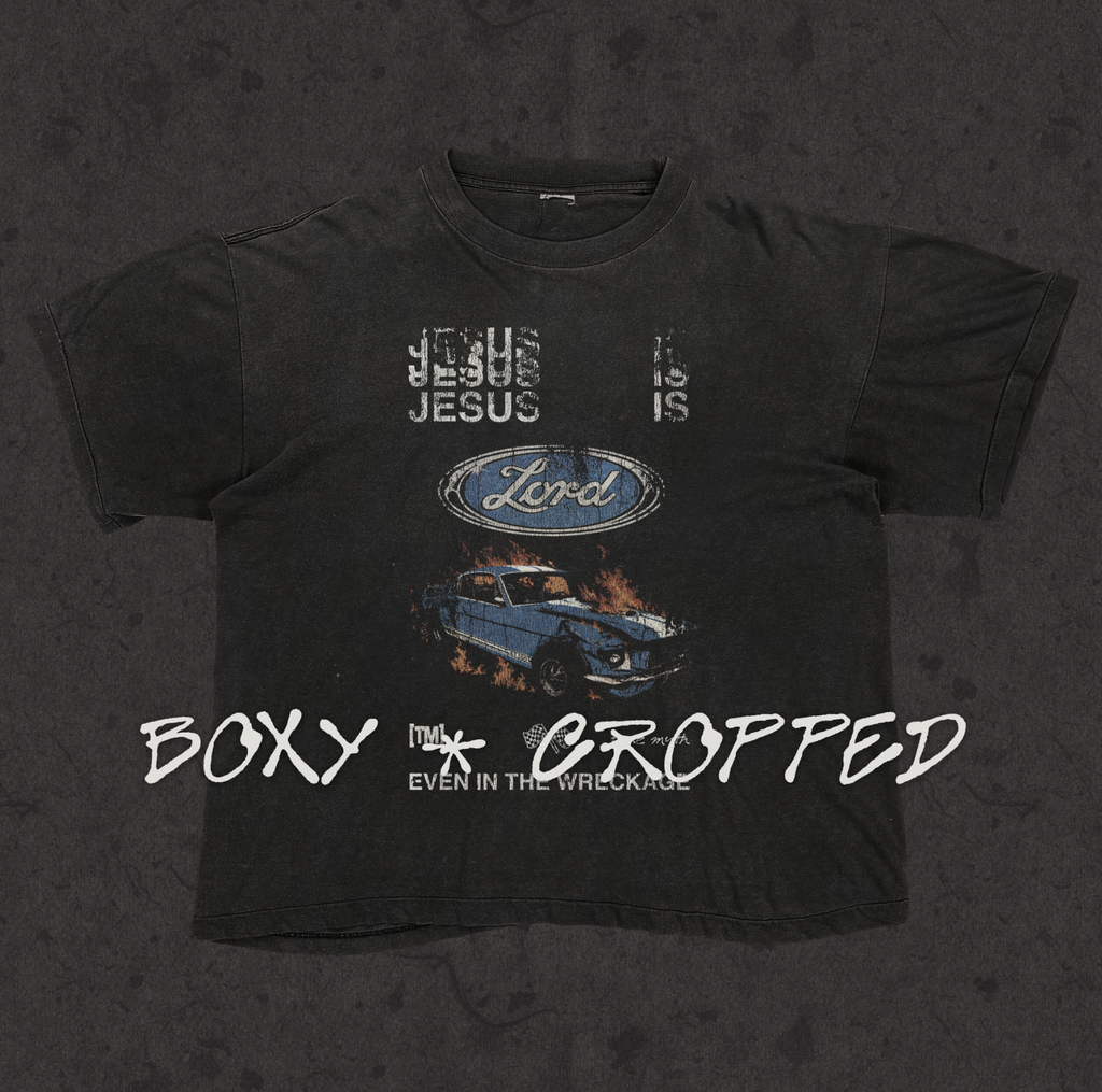 Boxy cropped tee with the hand-drawn 'Jesus is Lord Even In The Wreckage' design by True Myth, stone wash black