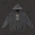 Oversized Retro Washed Hoodie in faded black with the My Treasure Is In Heaven design, front view
